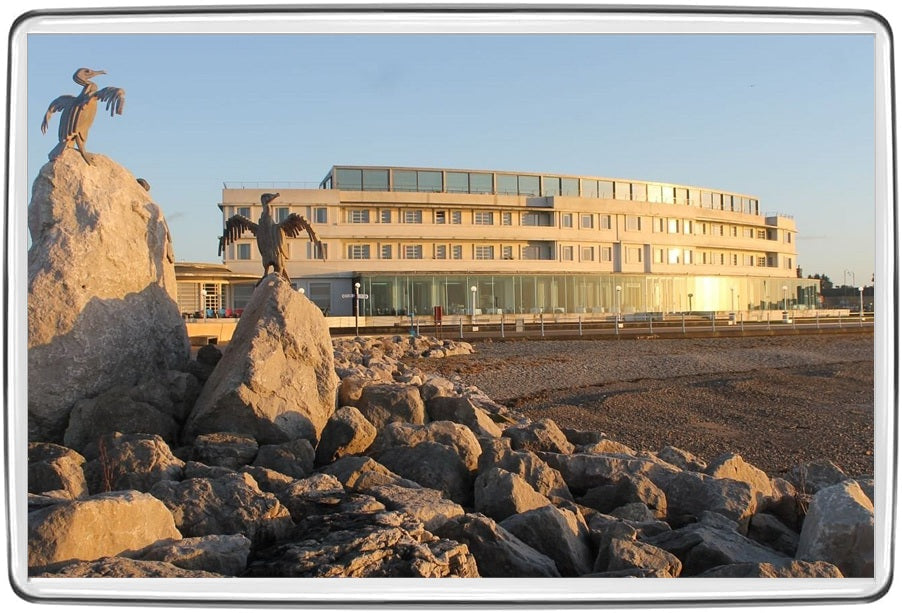 Midland Hotel Morecambe beside the seafront bird sculptures in warm evening light